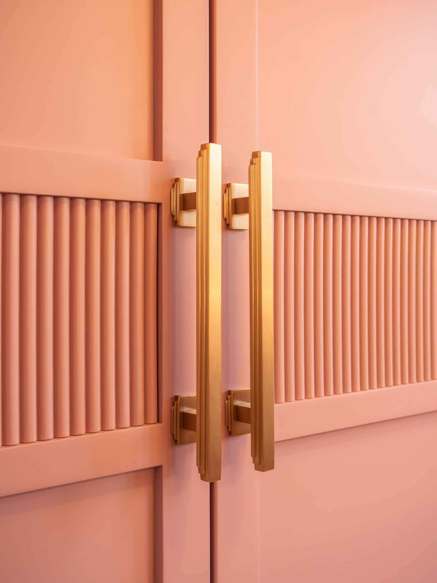 Completed bespoke dressing room Manchester — pink marbled gloss by Hafferty Interiors