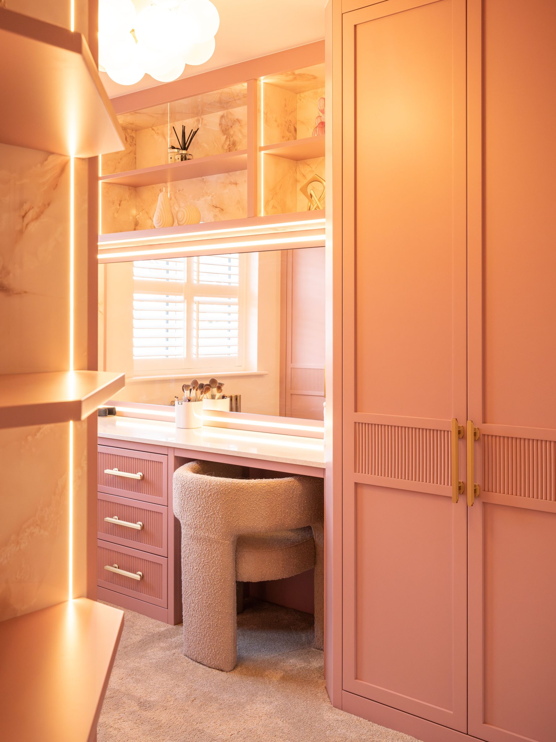 Bespoke pink dressing room with reeded brass inlay — Evans commission by Hafferty Interiors Manchester