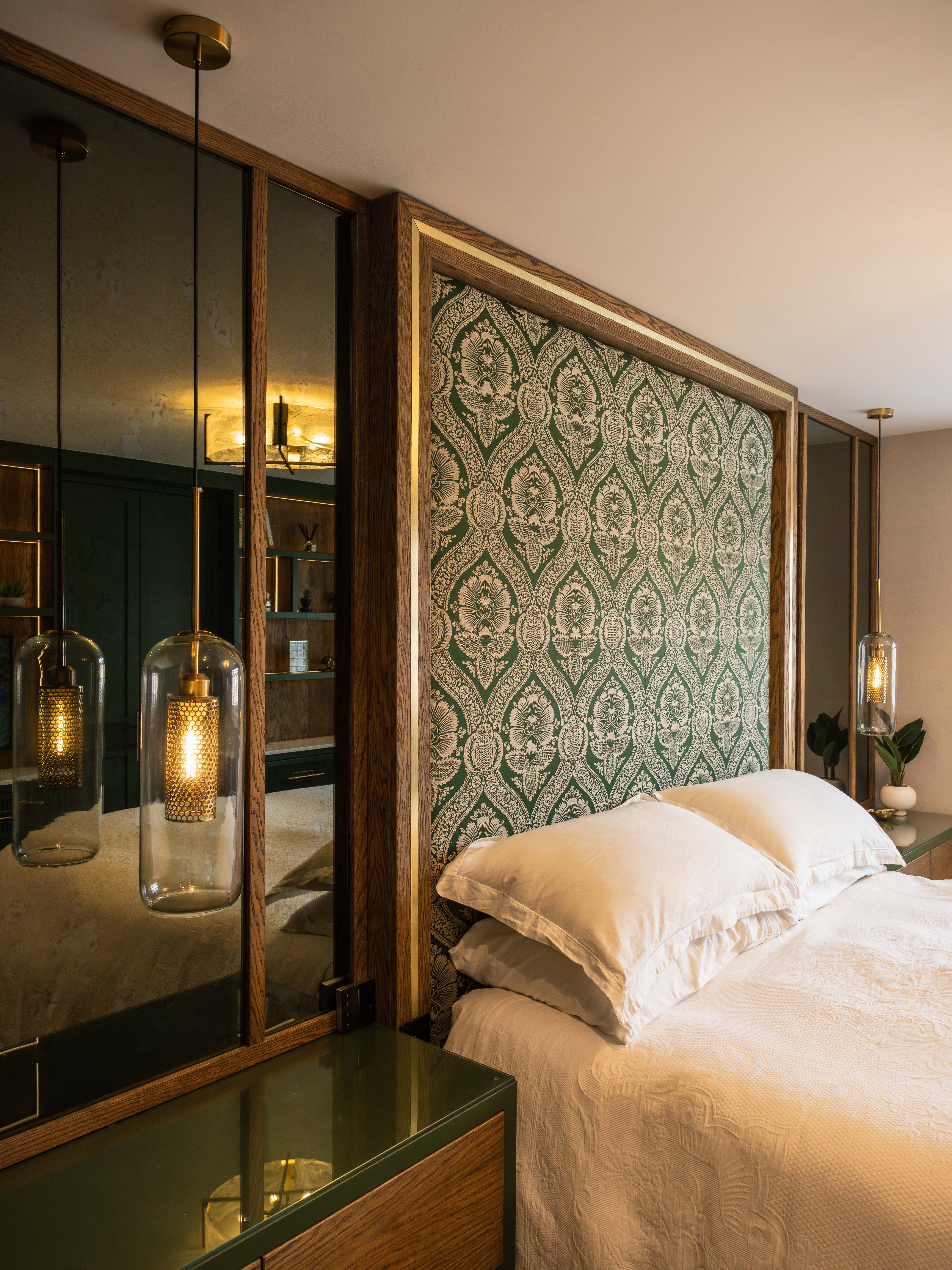Bespoke luxury headboard with botanical fabric and antiqued mirror — fitted master bedroom Manchester by Hafferty Interiors