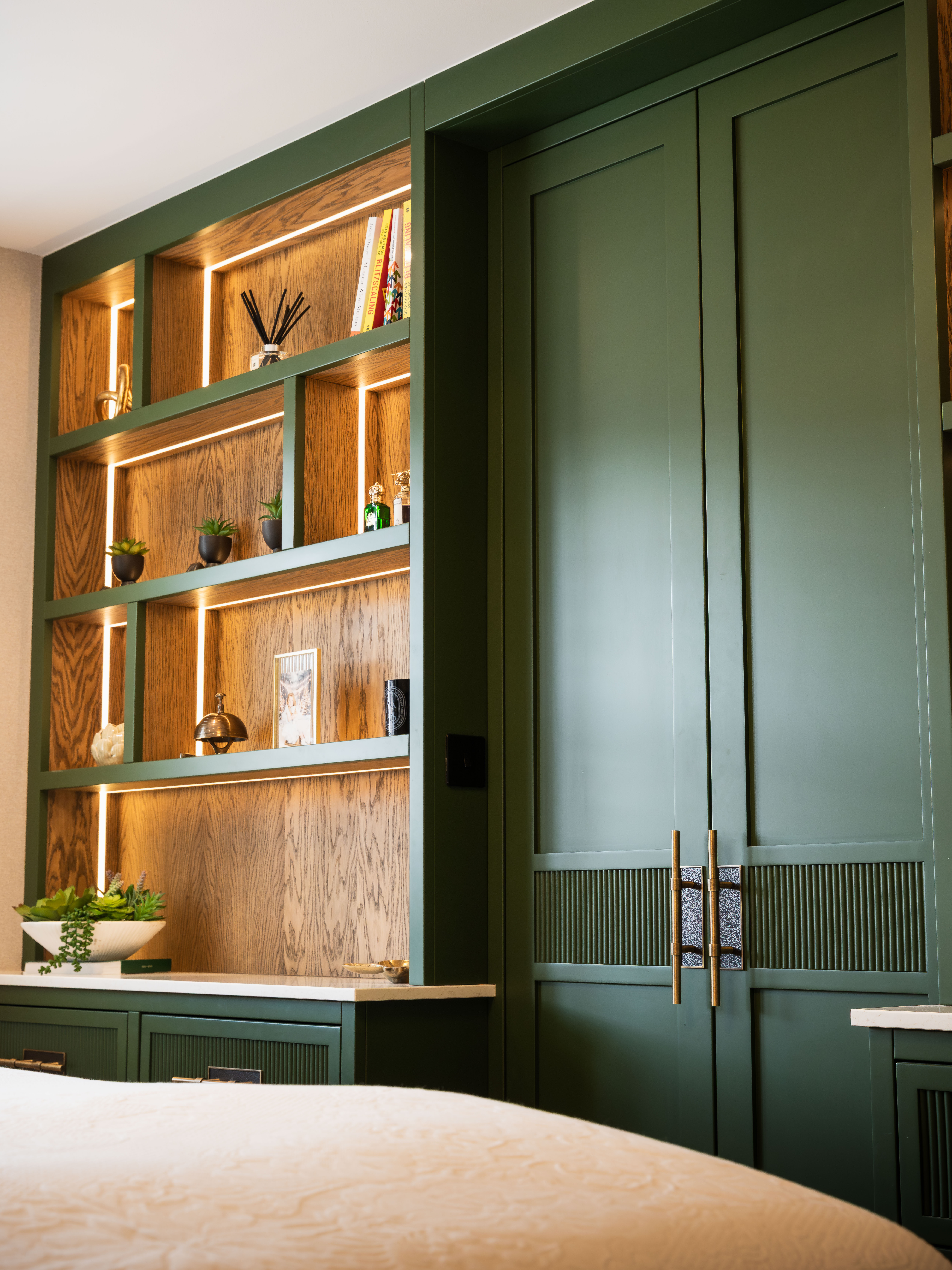 Relaxing bed view in Farrow and Ball green fitted master bedroom Manchester — Hafferty Interiors