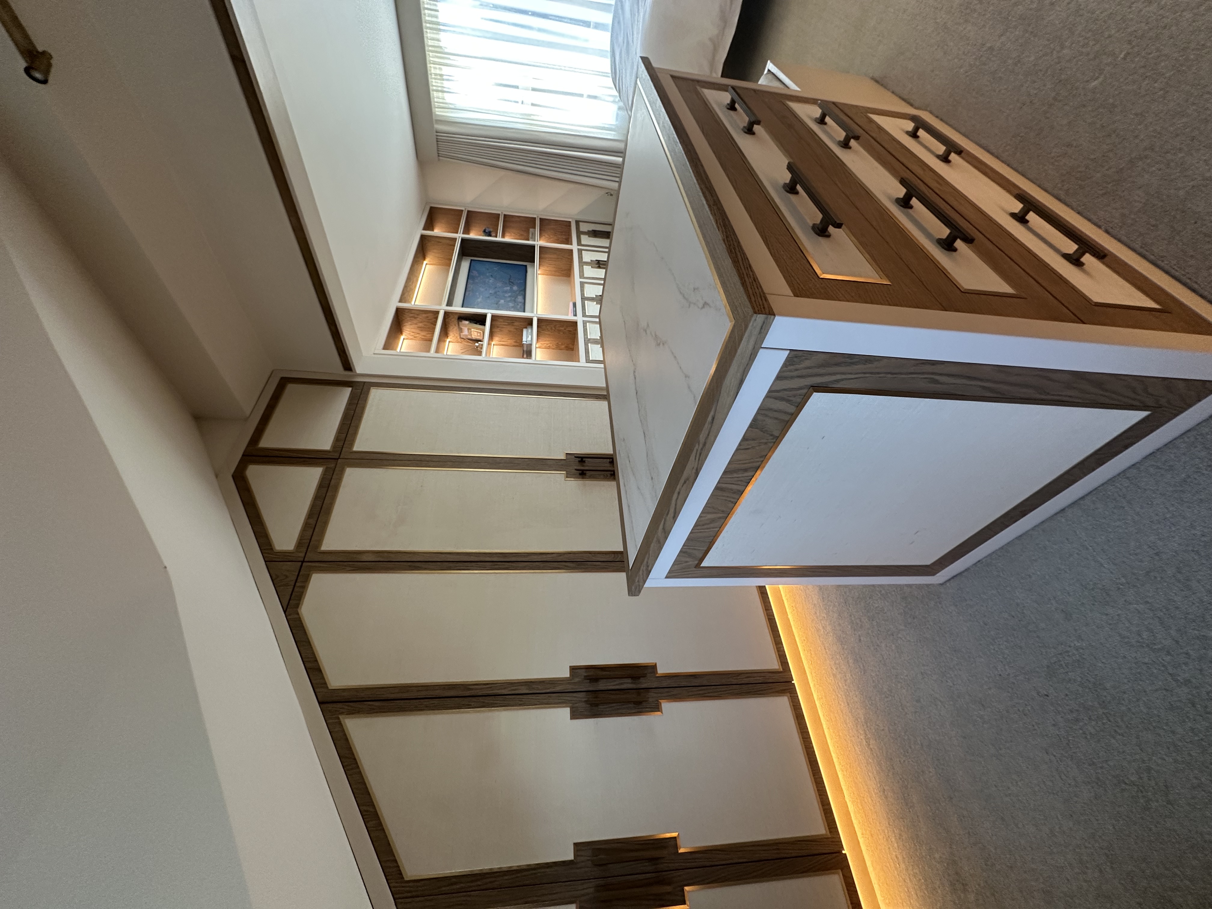 Bespoke angled fitted wardrobes — master bedroom suite Manchester by Hafferty Interiors