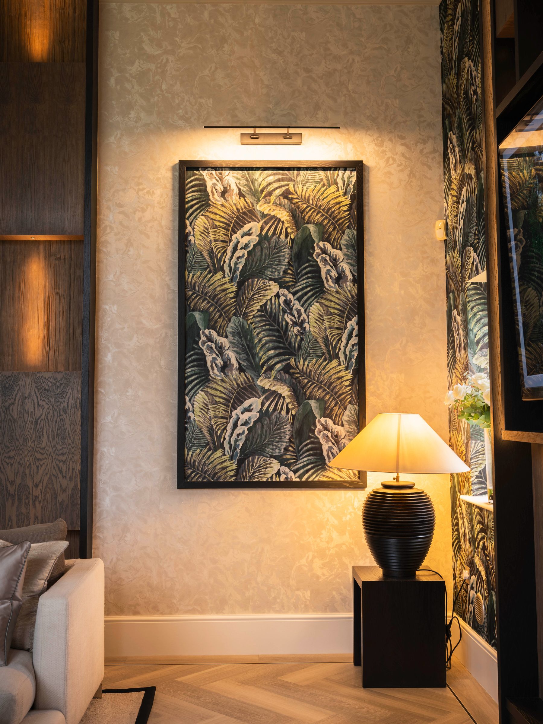 Large botanical Arte artwork panel with picture light and ribbed lamp — luxury living room by Hafferty Interiors
