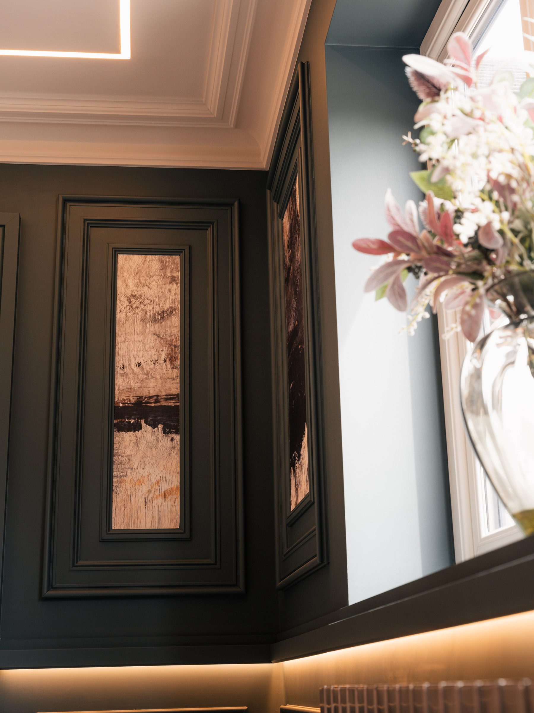 Bespoke dark painted wall panelling with copper metallic inset panels — Hafferty Interiors Boothstown