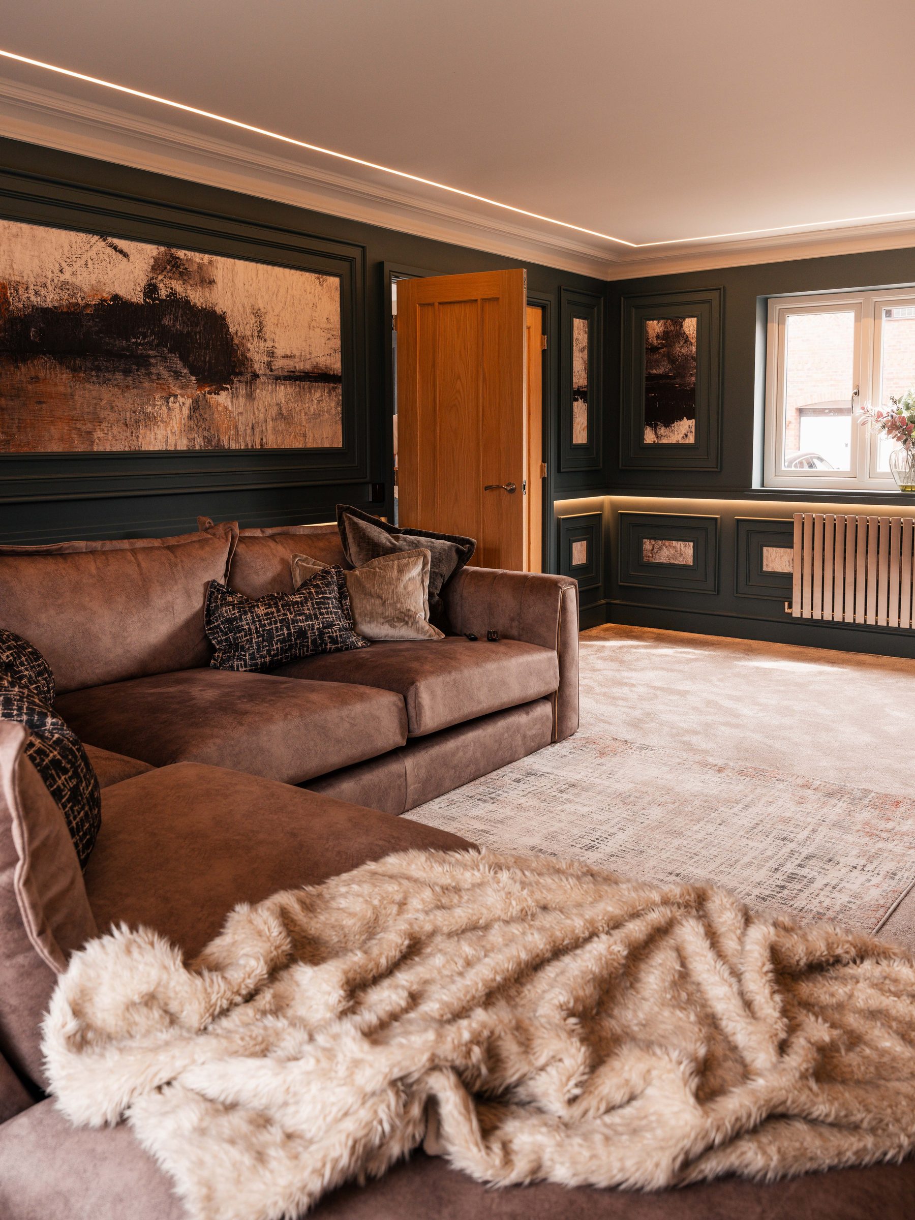 Bespoke panelled living room full view with large suede corner sofa — Boothstown by Hafferty Interiors