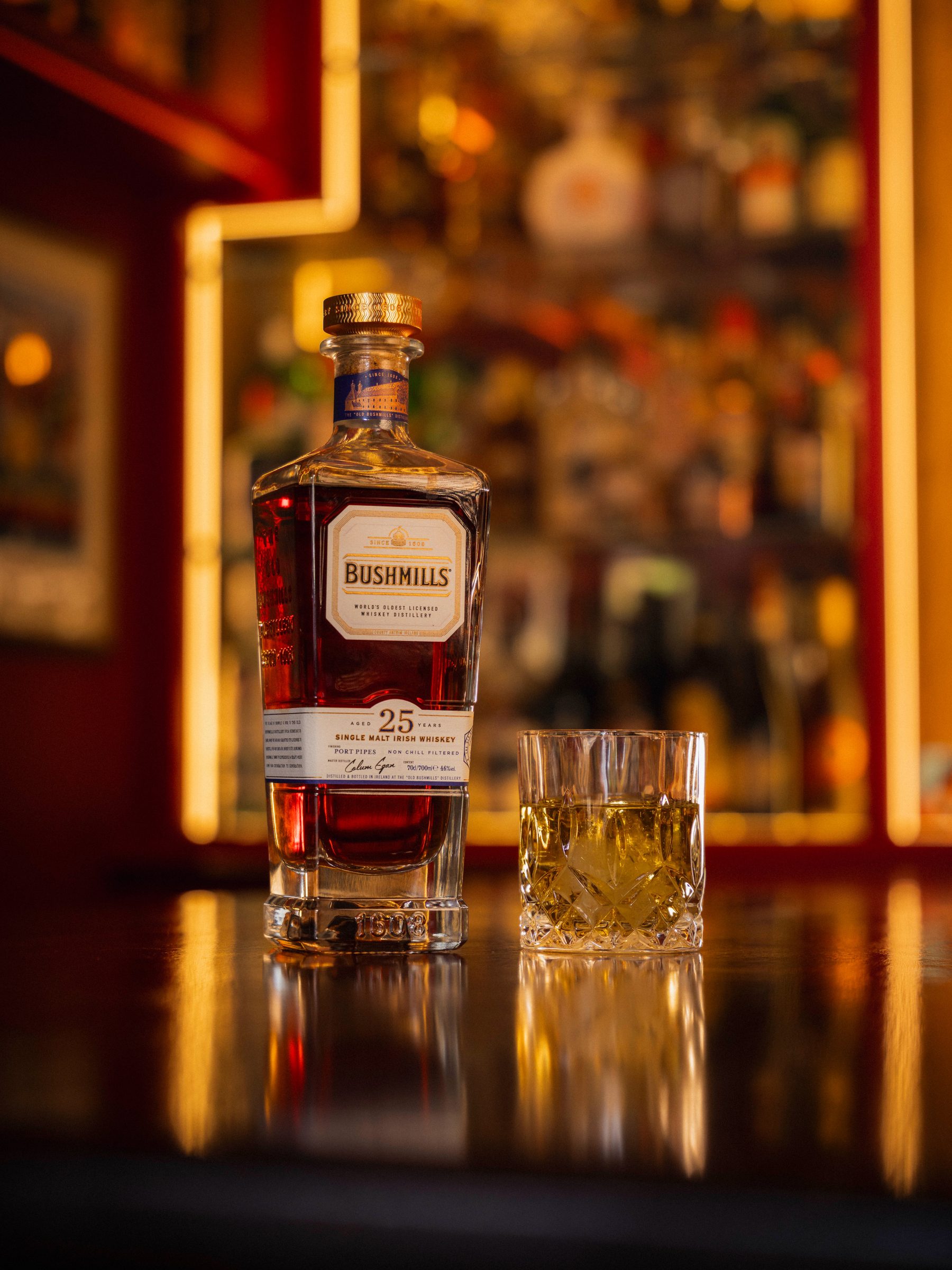 Bushmills 25 Year Single Malt Irish Whiskey on the bar counter — The Champions Bar by Hafferty Interiors