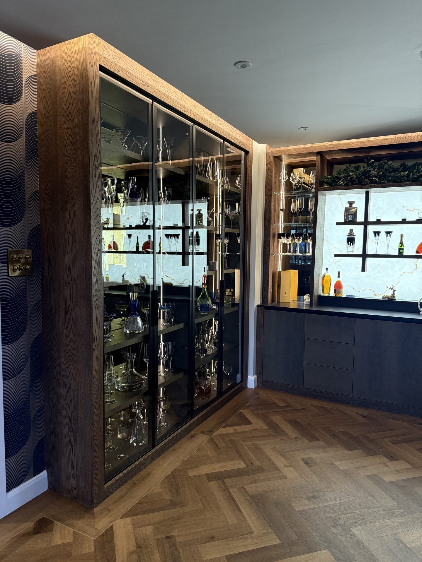 Toughened glass shelving with bronze tinted glass — luxury home bar Wilmslow by Hafferty Interiors