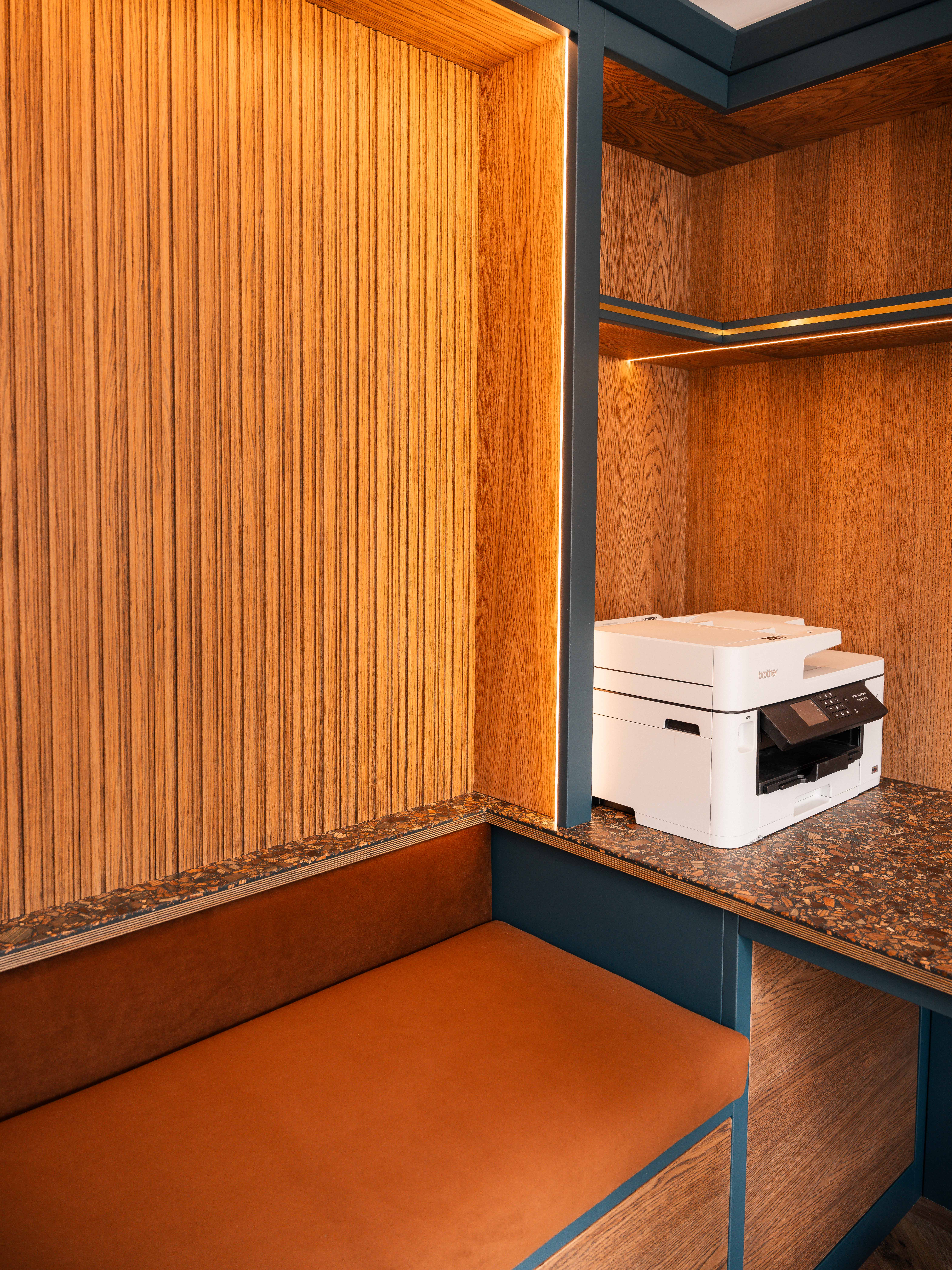 Corner detail — velvet bench, oak slat wall and Havwoods worktop by Hafferty Interiors Manchester