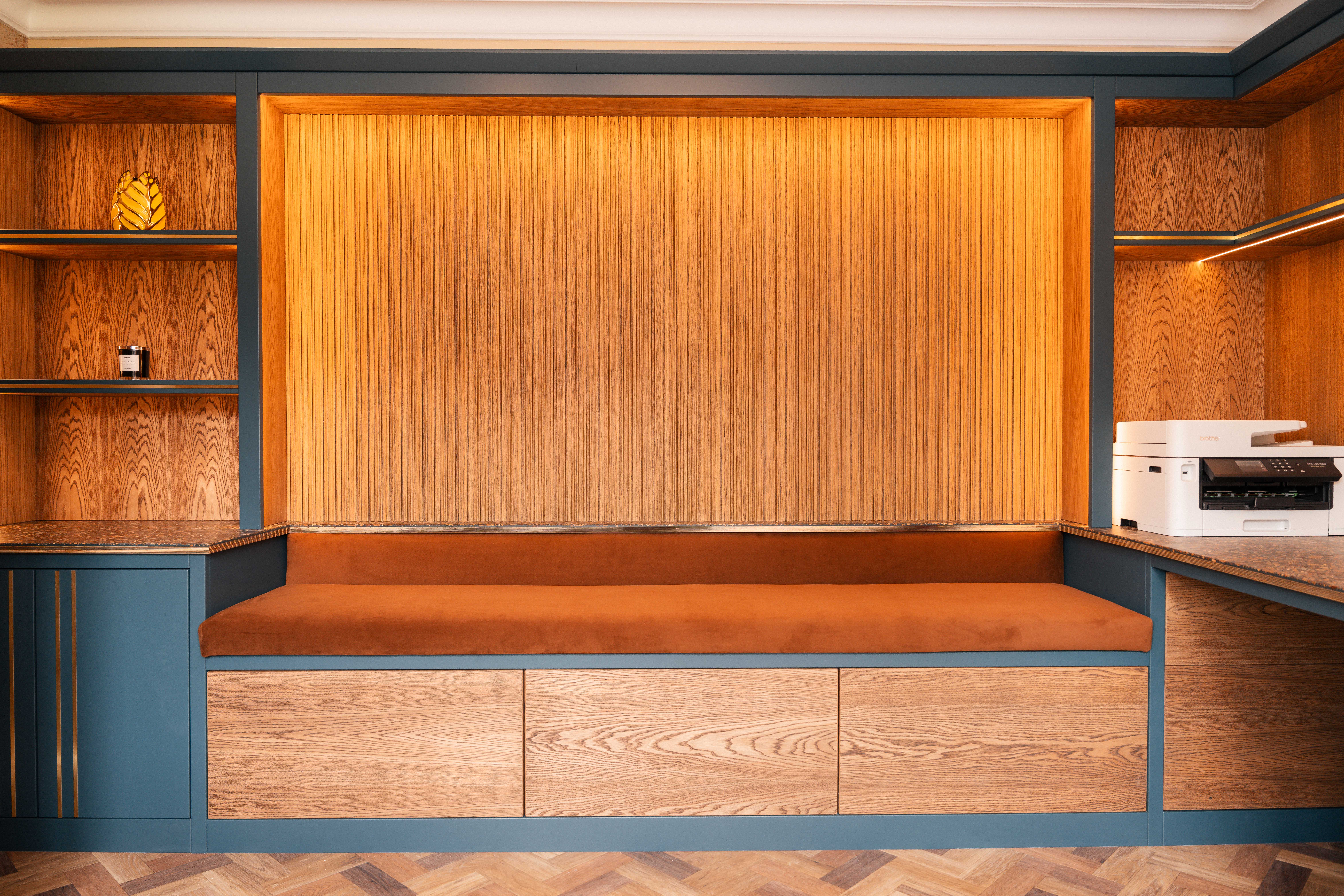 Built-in velvet bench and oak slat feature wall in bespoke home office — Boothstown Manchester by Hafferty Interiors