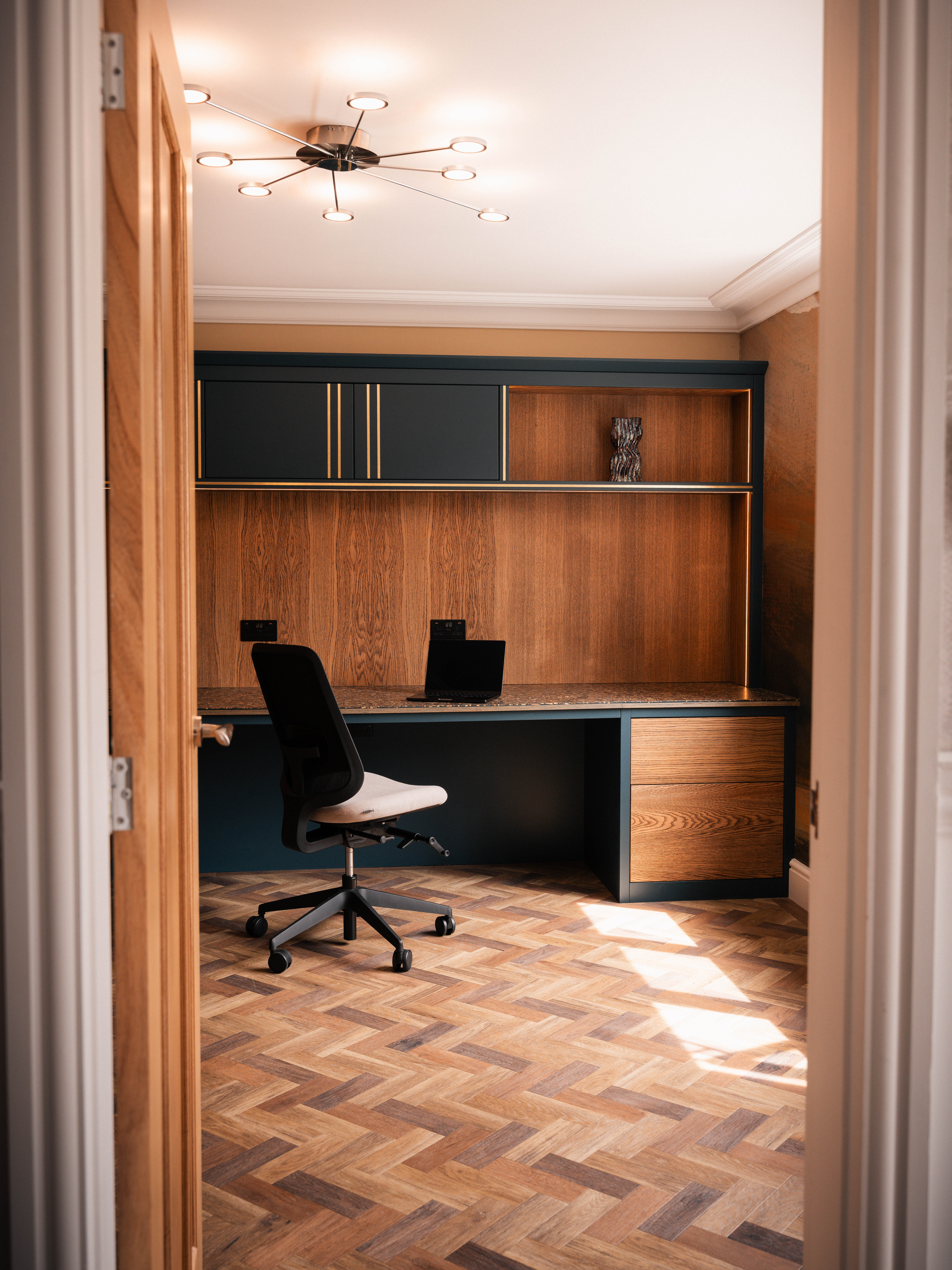 Bespoke home office through doorway — Boothstown Manchester by Hafferty Interiors