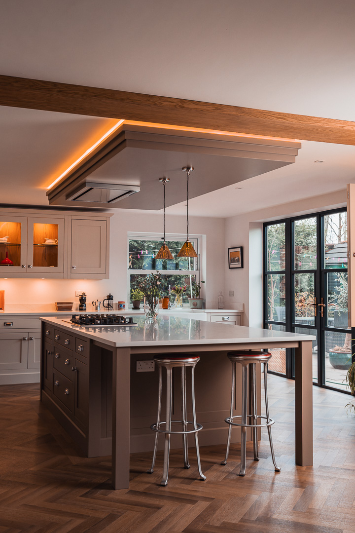 Bespoke in-frame kitchen with contrasting island, bespoke painted coffer ceiling and bifold garden doors — Hafferty Interiors