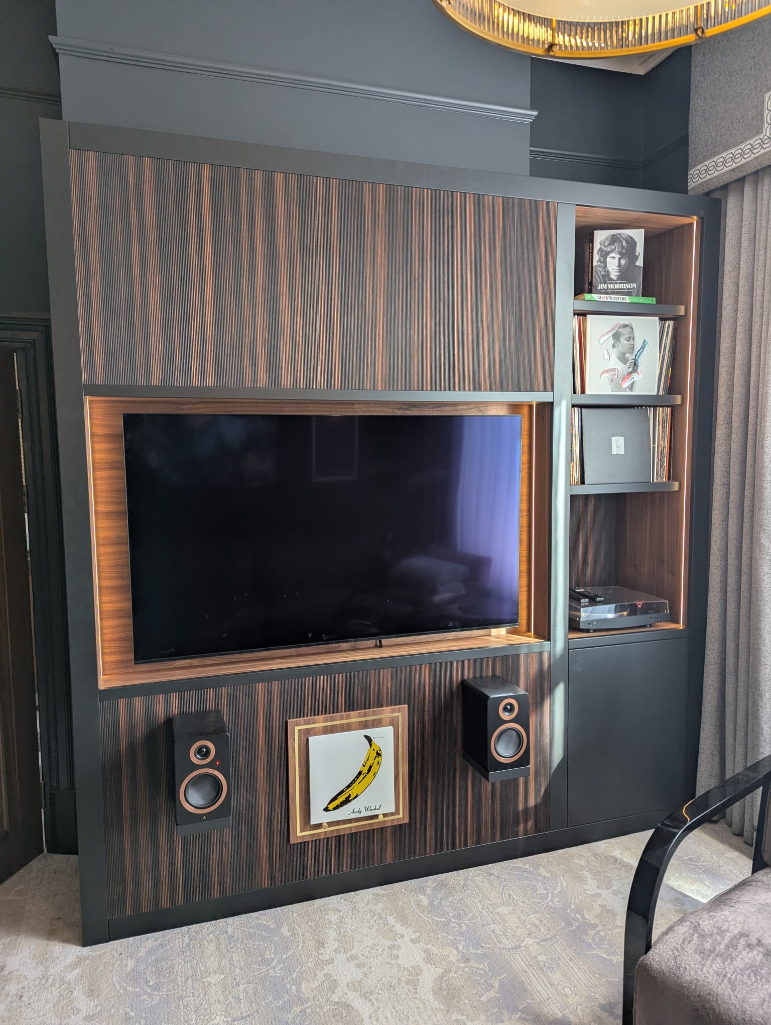 Bespoke macassar ebony media unit with vinyl record storage tower and LP turntable shelf — Hafferty Interiors