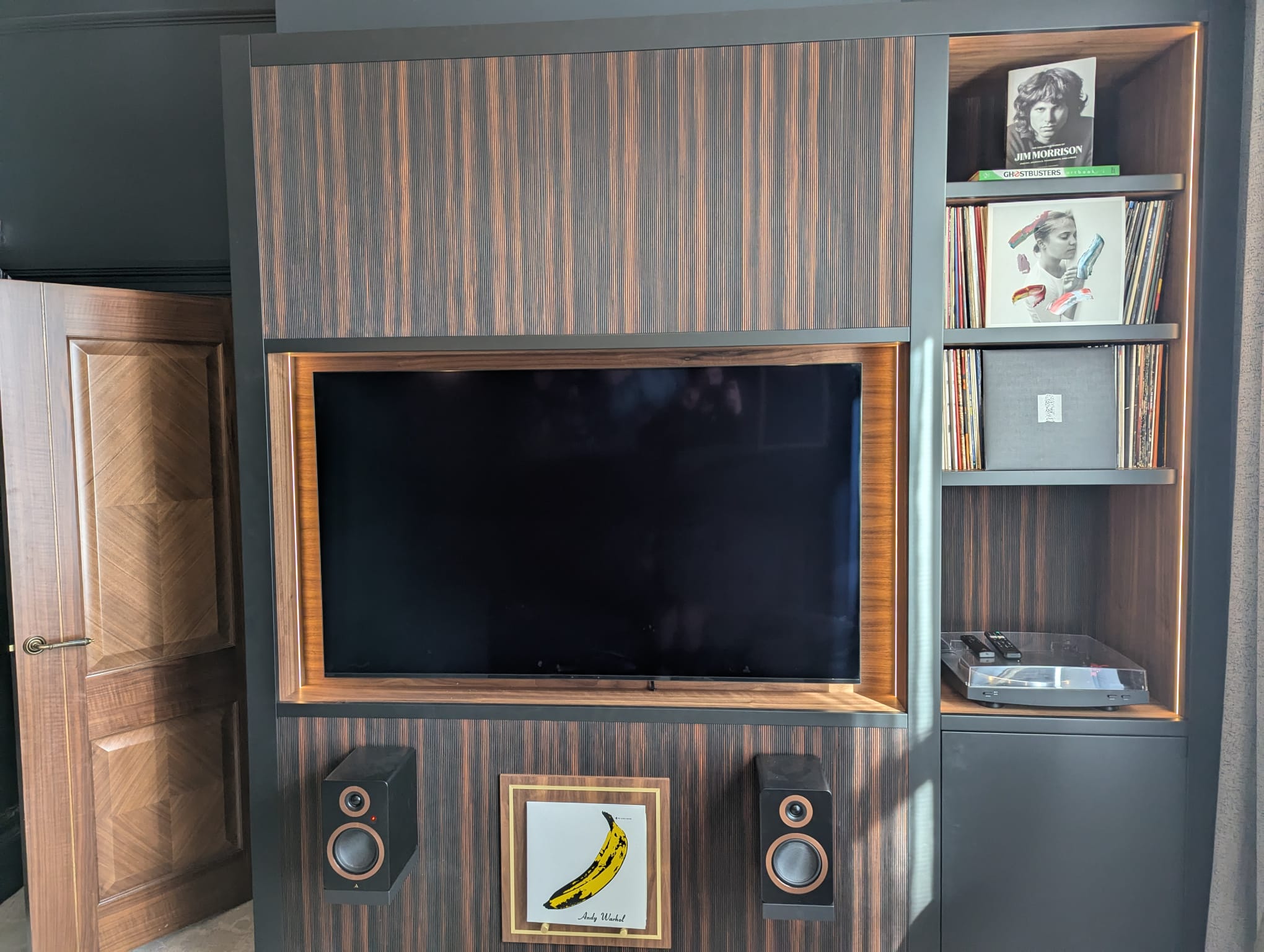Bespoke ebony veneer media unit with vinyl record display, LP turntable shelf and integrated speakers — Hafferty Interiors