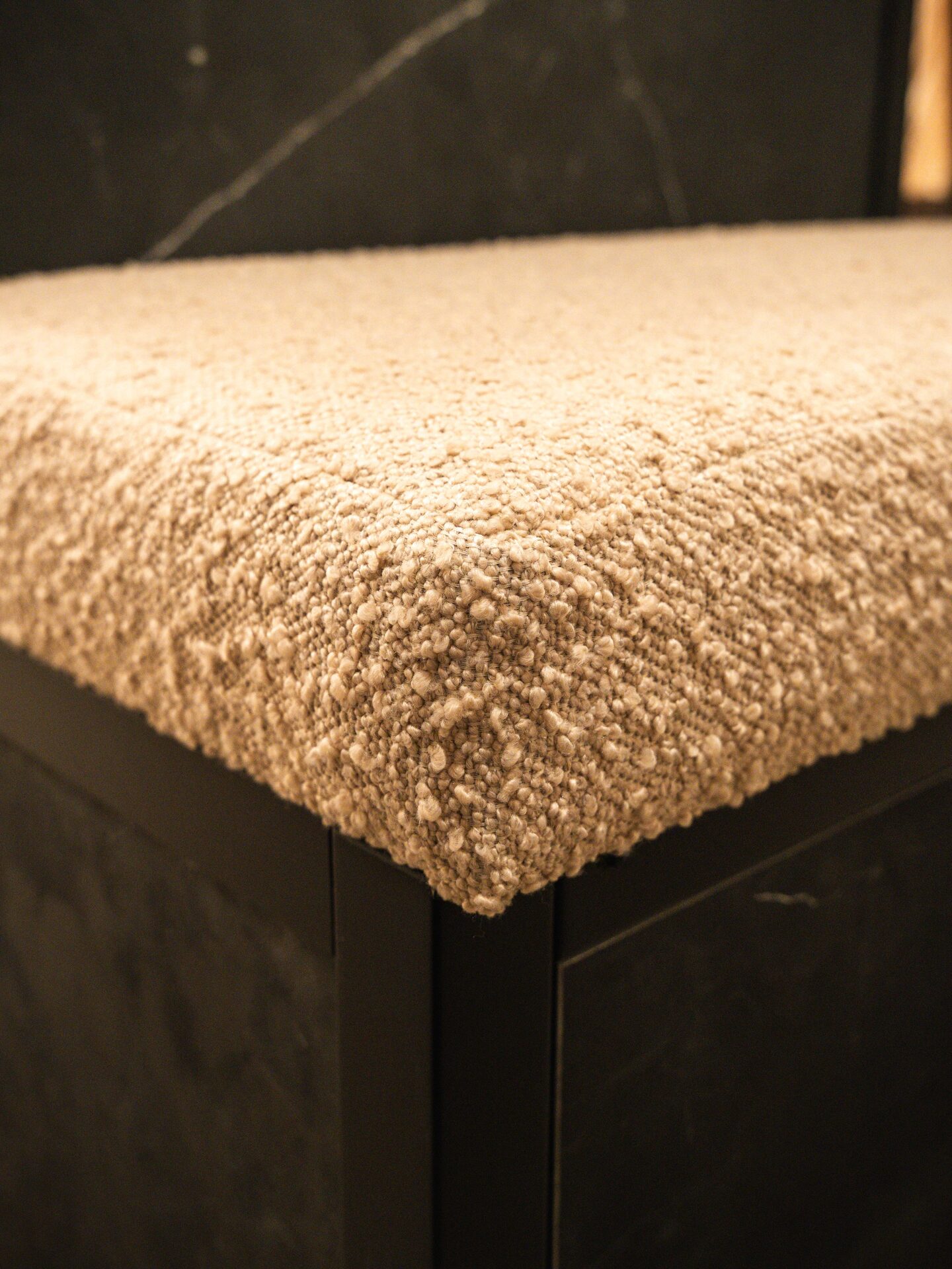 Bespoke upholstered seating integrated into walnut wardrobe — Hafferty Interiors Manchester