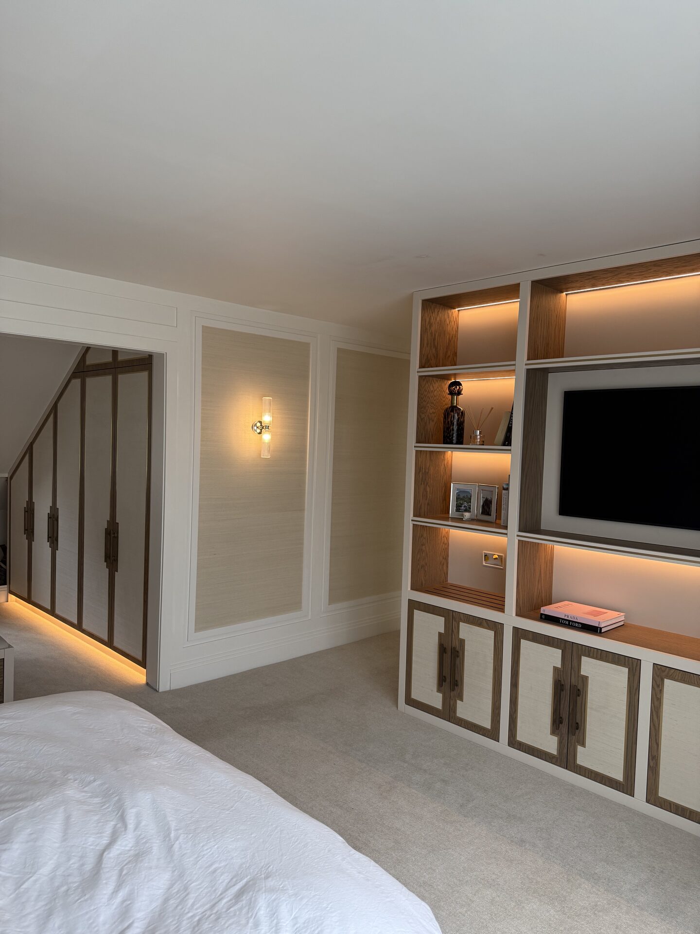 Bespoke master suite walk-in wardrobe and media unit — Hafferty Interiors Manchester